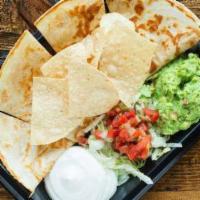 Pancho Villa Quesadilla · Recommended. Filled with jack, cheddar cheese guacamole, pico de gallo, and sour cream on th...