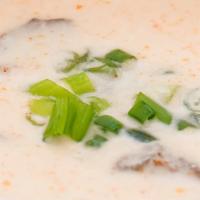 Thai Coconut Soup · Made fresh daily with scallions and mushroom