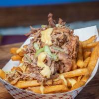 Porky Fries · 2 sides of fries combined with creamy nacho cheese, guava sauce and pulled Pork