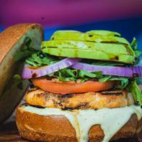 Salmon Burger · Try our NEW Salmon burger. Comes with arugula, tomatoes, onions, avocado, cilantro sauce, ou...