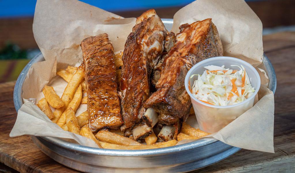 Ribs Con Papitas · Perfectly seasoned bbq Ribs with a side French fries and coleslaw