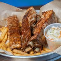 Ribs Con Papitas · Perfectly seasoned bbq Ribs with a side French fries and coleslaw