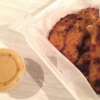 Chicken Tenders · Hand breaded chicken breast. Comes with choice of honey mustard or barbecue dipping.