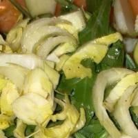 Baby Arugula Salad · Arugula, diced tomatoes, shaved parmesan, lemon dressing.