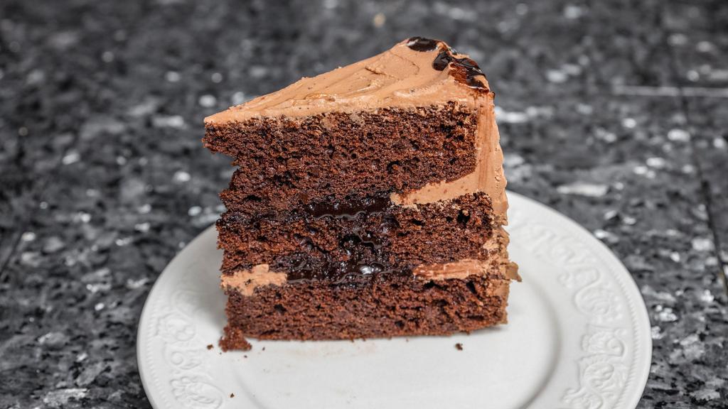 Chocolate Layer Cake · A heavenly soul satisfying treat. Chocolate layers filled with a creamy dark chocolate ganache then frosted with a sweet chocolate buttercream frosting.