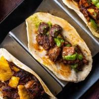 Tacos Mexicanos · 4 Tacos: chicken al carbon, carnitas, steak al carbon, al pastor