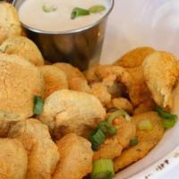 Fried Pickle Chips · Hand-breaded pickle chips fried to perfection with spicy ranch dip