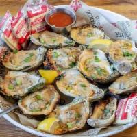 Char Grilled · Gulf oysters topped with garlic herb butter and parmesan cheese.