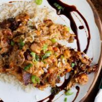 Voodoo Chicken · Grilled chicken with a creamy reduction of wine, caramelized onions, bacon and crawfish with...