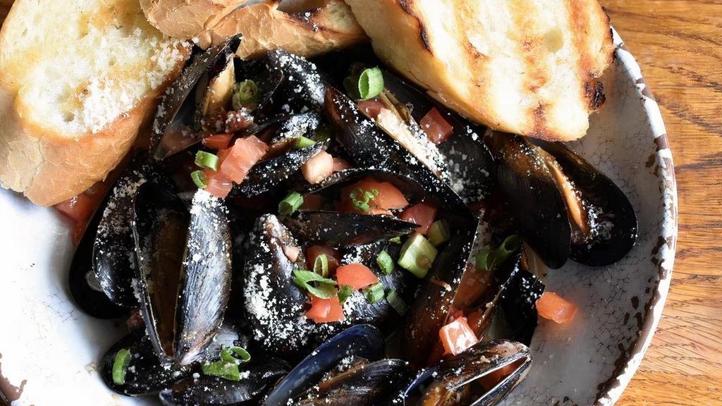 Steamed Mussels · Mussels steamed in a garlic. wine sauce.