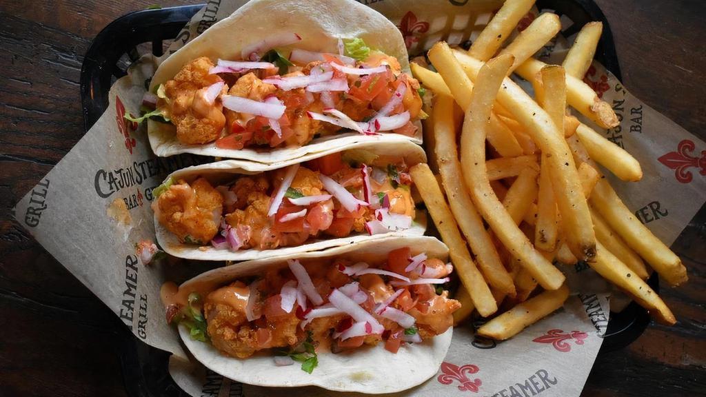 Fire Shrimp Tacos · Flour tortillas stuffed with fried shrimp and topped with fresh pico de gallo and our creamy fire sauce.