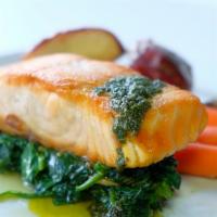 Wild Pacific Salmon · Topped with homemade pesto and on a bed of broccoli & roasted potatoes. Gluten-free.