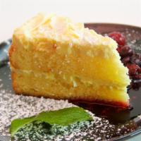 Limoncello Sponge Cake · Layers of sponge cake mascarpone limoncello mousse and white chocolate shavings.