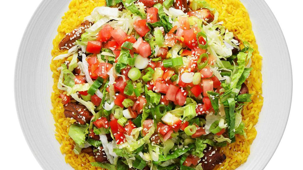 Oriental Chop-Chop® · Slow simmering thighs cooked in a sweet tangy teriyaki glaze with lettuce, tomatoes, scallions, and sesame seeds over yellow rice.