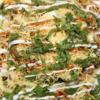 Samosa Chaat · Vegetarian. vegetable samosas topped with chickpea curry, onion, mint, garlic, and tamarind ...