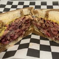 Stacked Pastrami · A heaping portion of hot pastrami or  corned beef(see upcharge)on your choice of bread, topp...