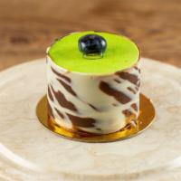 Pistachio Mousse Cake · Pistachio mousse blueberry cream and chocolate brownie.