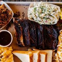 Backyard Bbq Tray · The ultimate crowd pleaser. A half rack of ribs, pulled pork, chili dogs, pickled veggies, B...