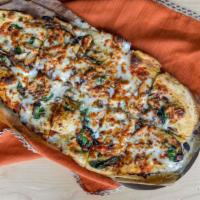 The Smoking Herb Pizza · The white sauce is slamming, cheese blend, spinach, red onions and mushrooms and with smoked...