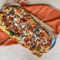 R.E.A.M. Pizza · The white sauce is slamming, cheese blend, spinach, pepperoni, pulled Italian sausage, red o...