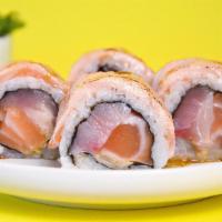 Revolution Roll · Japanese Hamachi, Scottish Salmon, fresh ginger and spicy mayo topped with salmon torched an...