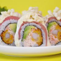 Citric Roll · Shrimp tempura, krab, avocado topped with wild ahi tuna, citrus sauce and tempura bites