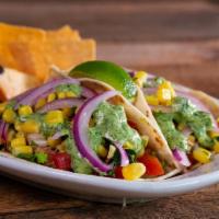 Three Chicken Tacos · (Available til 11pm) Pulled chicken, fresh avocado, pico de gallo, roasted corn salad, lime-...