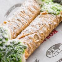 Cannolis (2) · Crisp Sicilian pastry shells filled with sweetened ricotta and chocolate chips, dipped into ...