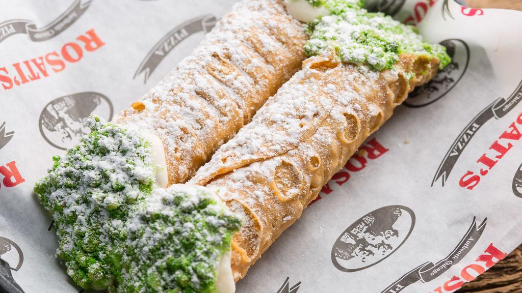 Two Cannolis · Crisp Sicilian pastry shells filled with sweetened ricotta & chocolate chips, dipped into mixed nuts & covered with powdered sugar. 540 cal.