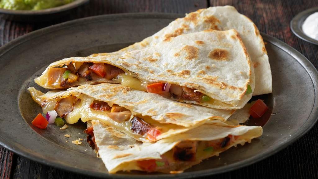 Grilled Quesadilla · Your choice of protein, flavorful salsas, sauces and toppings, served in a flour or whole wheat tortilla, lightly grilled to perfection. Cheese included.