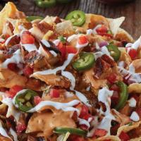 3-Cheese Nachos · Freshly made tortilla chips topped with signature 3-cheese queso or fiery diablo queso, and ...