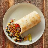Impossible Burrito · Impossible plant-based protein and grilled fajita veggies with cilantro lime rice, black bea...