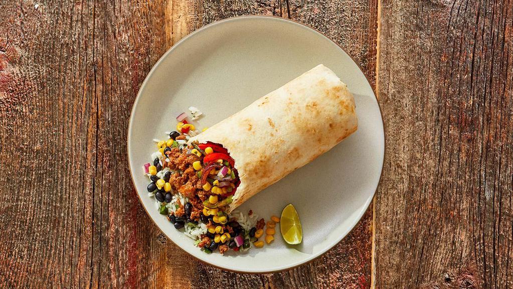 Impossible Burrito · Impossible plant-based protein and grilled fajita veggies with cilantro lime rice, black beans, salsa verde, and chile corn salsa wrapped in a flour or whole wheat tortilla.