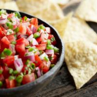 Chips & Salsa · White corn chips freshly fried in 100% soybean oil, seasoned with salt and lime, and your ch...