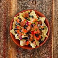Nachos · Kid-sized nachos with a side of applesauce, beans, or tortilla chips, and choice of 100% jui...