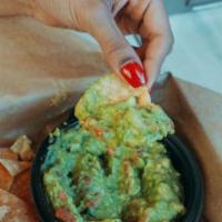 Chips & Guacamole · Fresh Hass avocados, cilantro, tomatoes, onions and a splash of lime juice.