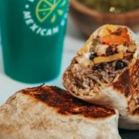 Queso Burrito · Queso addicts, rejoice! A flour tortilla stuffed with your choice of chicken or ground beef,...