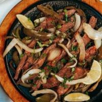 Fajita Platter · Chicken, steak or both brought out still smokin’ on a hot skillet with onions and peppers. S...