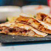 Grande Classic Quesadilla   · Your choice of chicken or ground beef with homemade refried beans and melted jack and chedda...