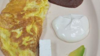 Simple Central Americano · Two eggs, refried beans, cheese, sour cream, and avocado. Served with corn or flour tortilla.