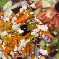 Small Greek Salad · Lettuce, tomato, onions, cucumbers, feta cheese, black olives, pepperoncini, and house dress...