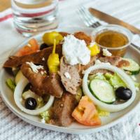 Large Gyro Greek Salad · Greek salad topped with tender gyro meat.