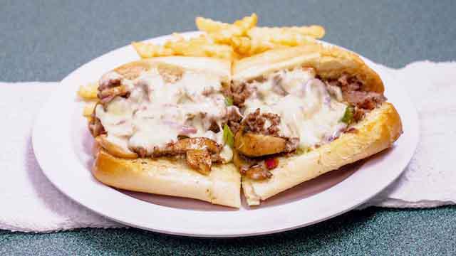 Philly Cheese Steak · Ribeye steak ,sauted bell peppers,mushrooms, red onions and topped with hot melted provolone cheese, mayo 
on Italian amoroso bread.
