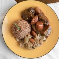 Oxtail · Oxtails seasoned to perfection in a bed of gravy over rice  stewed with an assortment of bel...
