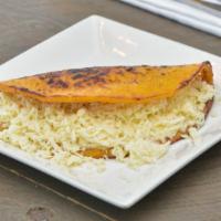 Cheese Cachapa · Corn cake made of fresh corn cooked in a budare (a clay or iron plate) served with fresh shr...