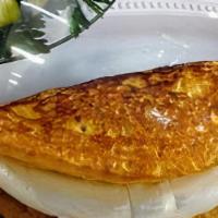 Guayanés Cachapa · Corn cake made of fresh corn cooked in a budare (a clay or iron plate) served with fresh whi...