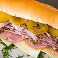 Cuban Sandwich · Pork, ham, Swiss cheese, pickles and mustard on Cuban bread.