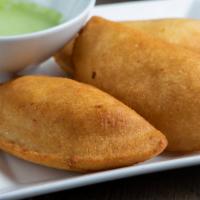 Cheese Fried Empanada · Savory crescent-shaped corn dough fried and filled with cheese.