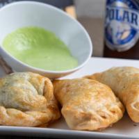 Meat Baked Empanada · Crescent-shaped savory pastry baked filled with beef.