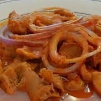 Lambi Conch · Served with white rice and bean sauce or diri kole (rice of the day), fried or boiled planta...